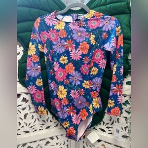 NWT Hurley long sleeve one piece surf suit swimsuit. Pink and blue floral print